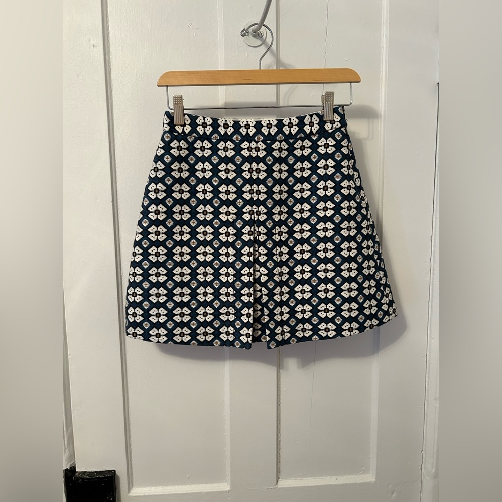Cream and teal patterned pleated skirt